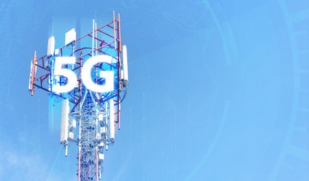 Telecommunication tower against blue sky with digital wireless network and futuristic technology...