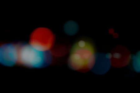 Abstract blur colorful  with bokhes on black backgroundの写真素材