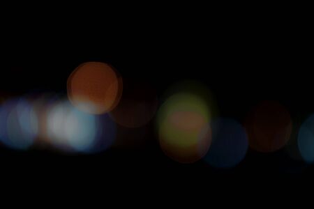 Abstract blur colorful  with bokhes on black backgroundの写真素材