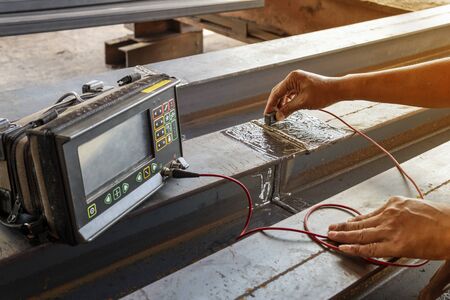 Checking defect in welded of steel add joint with process Ultrasonic testing (UT) of Non-Destructive Testing(NDT) at industrial factory.の写真素材