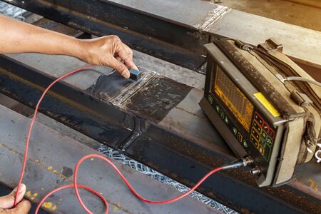Checking defect in welded of steel add joint with process Ultrasonic testing (UT) of Non-Destructive Testing(NDT) at industrial factory.の写真素材