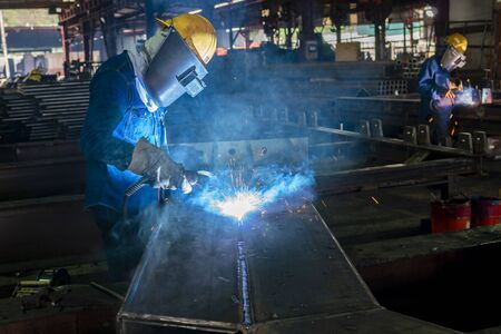The welder is welding a steel structure work with process Flux Cored Arc Welding(FCAW) and dressed...