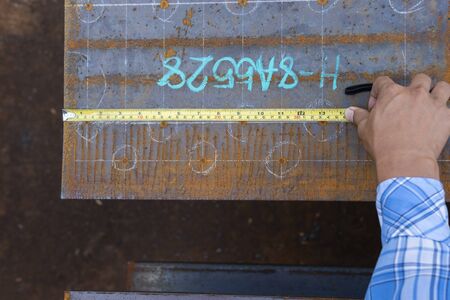 Use a measure tape  to measure the dimension before drilling holes.の写真素材