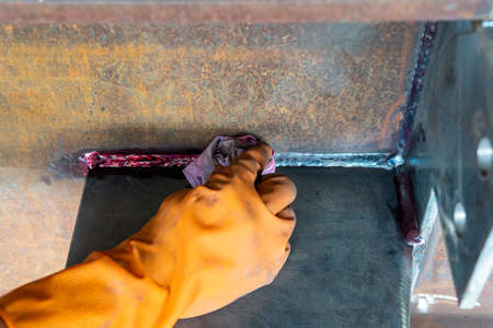 Step to use rag wipe Liquid Penetrant out to welded surface before Developer spray into the welded for Non-Destructive Testing(NDT) with process Penetrant Testing(PT).の写真素材