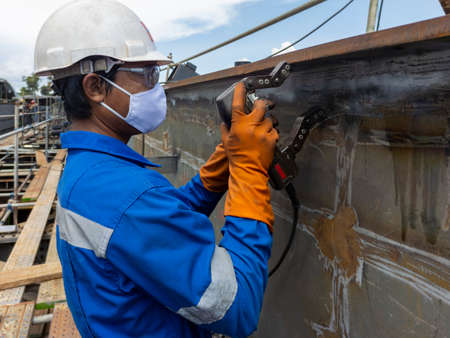 Checking defect in welded with process Magnetic Particle Testing(MT) of Non-Destructive Testing(NDT) at industrial factory.の写真素材