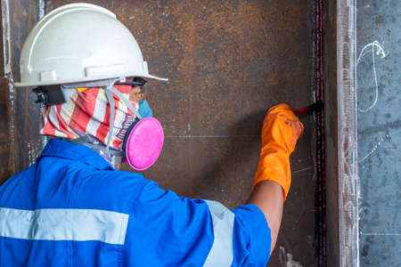 Step to use brush apply Liquid Penetrant into the welded for Non-Destructive Testing(NDT) with process Penetrant Testing(PT).の写真素材