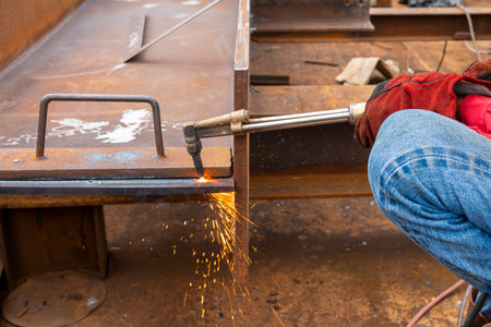 H-beam steel cutting with Hand Gas Cutting Torches, at the industrial factory.
