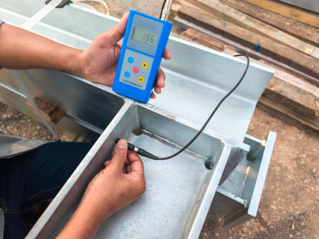 Measure the Coating Thickness Galvanized with a Coating Thickness Gauge by Specification of Project for Steel Structure Work at Industrial Factories.の写真素材