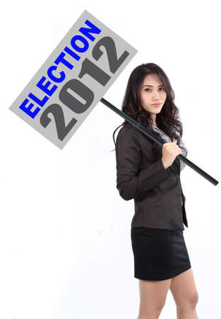 woman holding a sign to calling people goto election 2012の写真素材