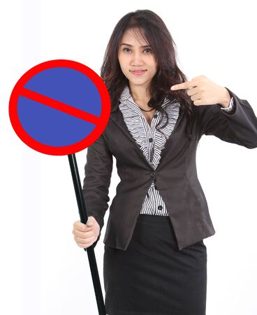 business woman holding traffic stop sign or no entryの写真素材