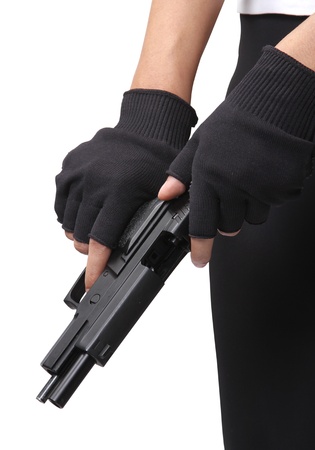 woman hold and loading ammunition her pistol on white background の写真素材