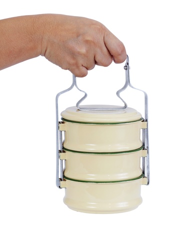 Closeup image of hand holding food carrier on white backgroundの写真素材