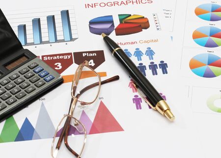 image of infographics for business report with pen glasses and calculatorの写真素材