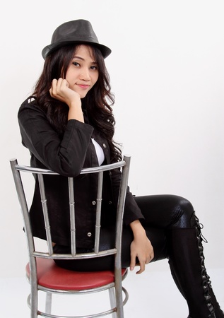 Asian young fashion model posing in the studio on white backgroundの写真素材