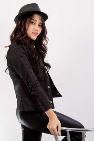Asian young fashion model posing in the studio on white backgroundの写真素材