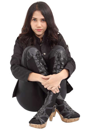 Asian young fashion model posing in the studio on white backgroundの写真素材