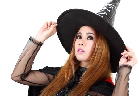 Image of portrait asian woman in black hat and black clothing on halloweenの写真素材