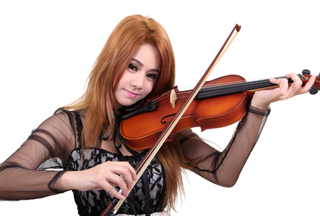 Image of asian woman play her violin on white backgroundの写真素材