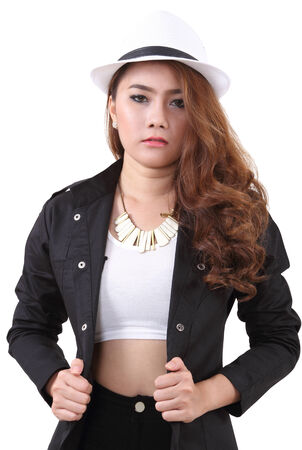 Asian young woman posing her black suit in studio on white backgroundの写真素材
