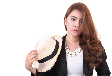Asian young woman posing her black suit in studio on white backgroundの写真素材