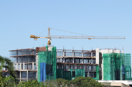 Image of tower crane working construct buildingの写真素材