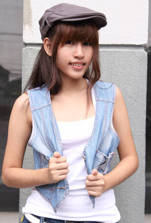 image of portrait young asian woman in jeans fashion outdoorの写真素材