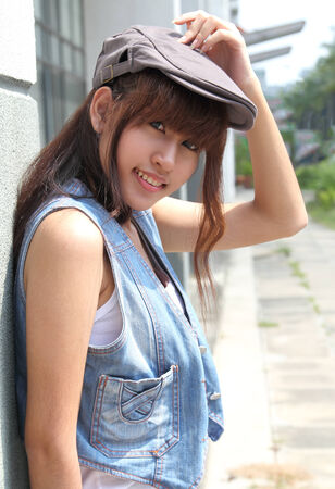 image of portrait young asian woman in jeans fashion outdoorの写真素材