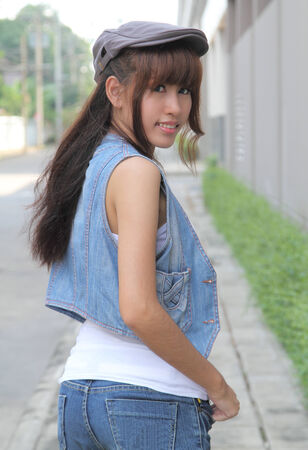 image of portrait young asian woman in jeans fashion outdoorの写真素材