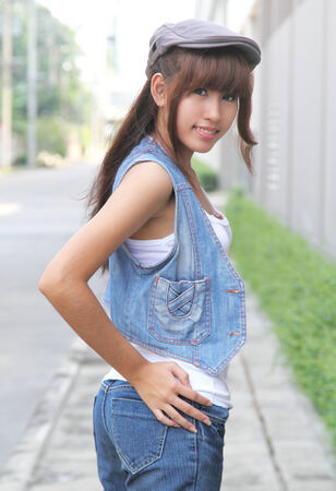 image of portrait young asian woman in jeans fashion outdoorの写真素材
