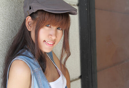 image of portrait young asian woman in jeans fashion outdoorの写真素材
