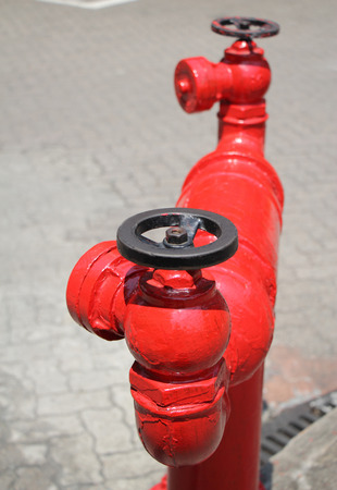 closeup image of red fire hydrant on the streetの写真素材
