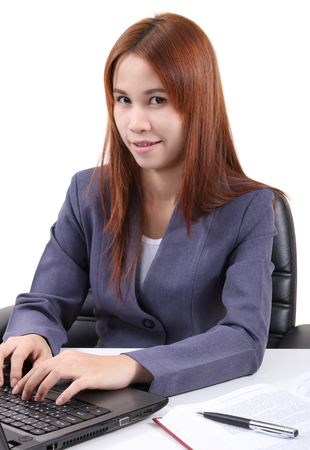 image of young asian woman working in office and white backgroundの写真素材