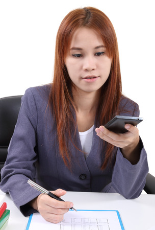 image of young asian woman working in office and white backgroundの写真素材