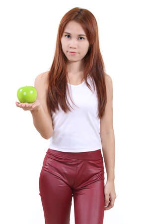 image of portrait young woman with an apple on white backgroundの写真素材