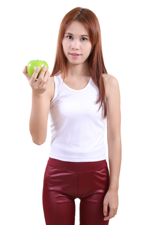image of portrait young woman with an apple on white backgroundの写真素材