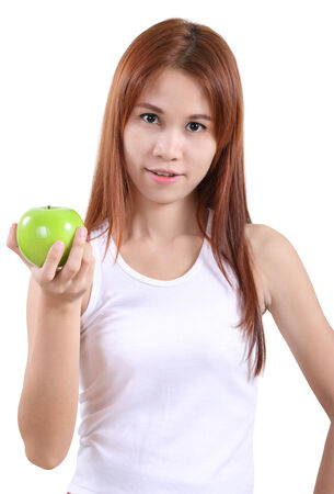image of portrait young woman with an apple on white backgroundの写真素材