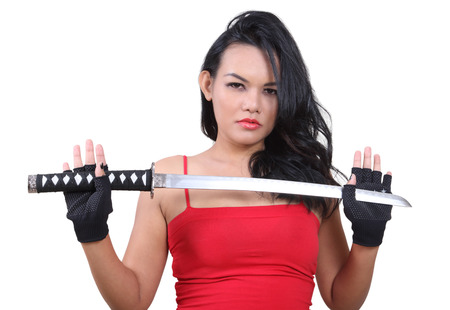 image of asian woman in red and black cloth holding samurai の写真素材