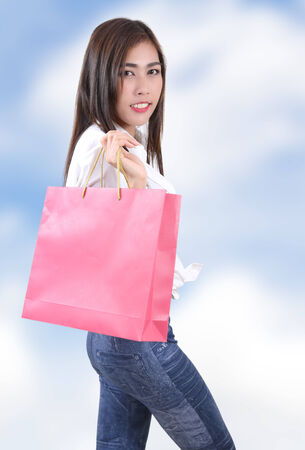 beautiful asian woman holding shopping bag on her handの写真素材