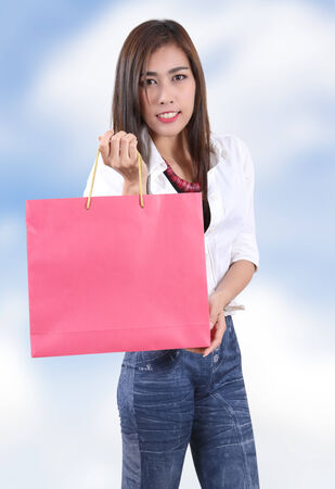 beautiful asian woman holding shopping bag on her handの写真素材