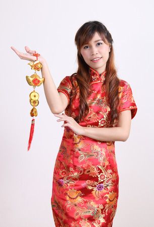 chinese woman happy in chinese traditonal dress on white backgroundの写真素材