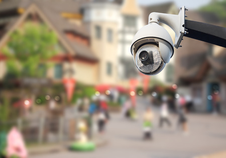 Closeup image of CCTV security camera outdoor in city