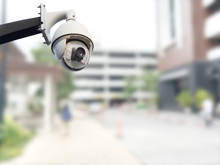 closeup image of CCTV security camera outdoor with blurred backgroundの写真素材