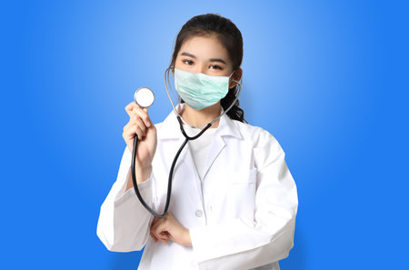 asian woman doctor in white uniform with maskの写真素材