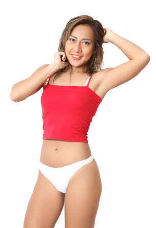 portrait beautiful asian woman in red croptop and white bikiniの写真素材