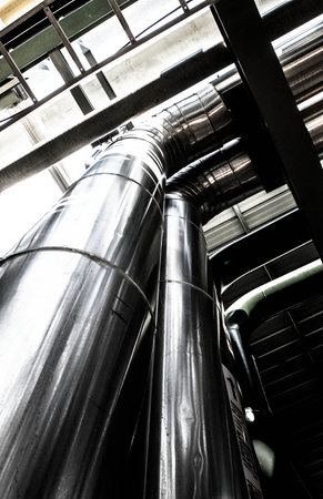 Industrial zone, steel pipelines and cables in a plantの写真素材