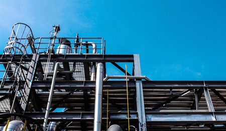 Industrial zone, steel pipelines and cables in a plant