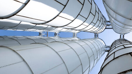 Industrial zone, steel pipelines and staircase in a plantの写真素材