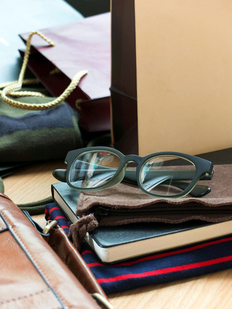 Newly bought clothes and eyeglass packed out at homeの写真素材