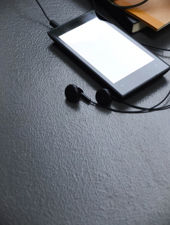 mobile music player on cement floorの写真素材
