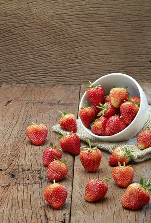 Fresh strawberries on old wooden backgroundの写真素材